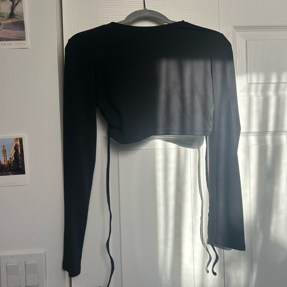 Black ribbed long sleeve crop top with open back